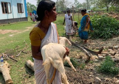 Assamese widow holding goat